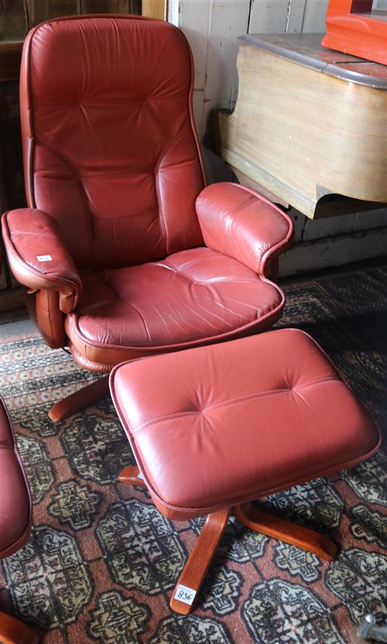 Mobel red leather upholstered swivelling and reclining armchairs and matching stool